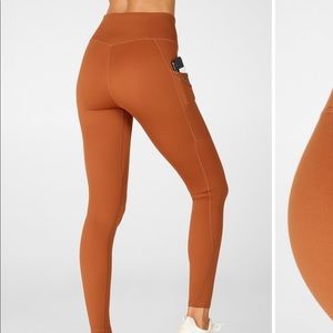 Fabletics Trinity High Waisted Pocket Legging in Teak Burnt Orange Small 27in
